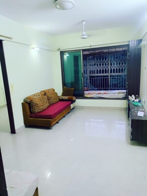 Living Room in 2 BHK Apartment at Lokpuram CHS, Vasant Vihar – for Rent