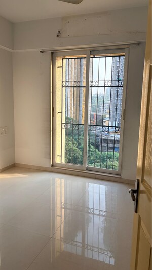 Room in 2 BHK Apartment at Vijay Galaxy, Waghbil – for Sale