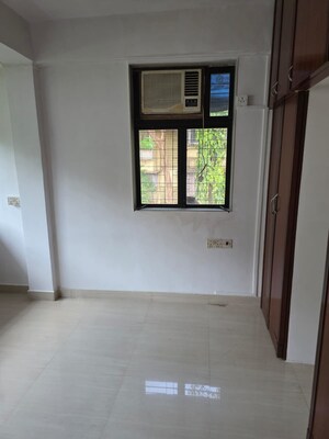 Room in 2 BHK Apartment at Samkeet CHS, Vile Parle East – for Sale