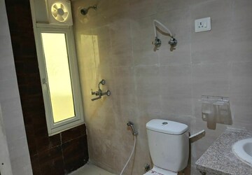 Bathroom in 3 BHK Apartment at Mahagun Mantra I, Sector 10 Greater Noida – for Rent