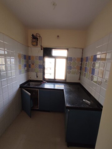 Kitchen in 1 BHK Apartment at Raunak Heights, Ghodbunder Road – for Rent