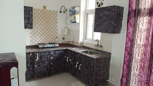 Kitchen in 1 RK Apartment at Amrapali Princely Estate, Sector 76 – for Rent