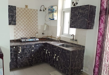 Kitchen in 1 RK Apartment at Amrapali Princely Estate, Sector 76 – for Rent