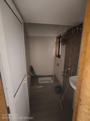 Bathroom in 2 BHK Apartment at Puranik Hometown, Ghodbunder Road – for Rent