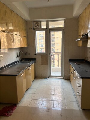 Kitchen in 3 BHK Apartment at Amrapali Princely Estate, Sector 76 – for Rent