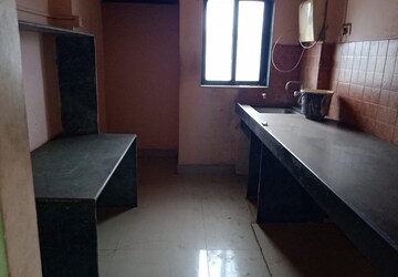 Kitchen in 2 BHK Apartment at Kavya Hill View CHS, Anand Nagar – for Rent