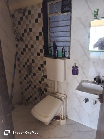 Bathroom in 1 BHK Apartment at Dharti Pressidio, Kandivali West – for Rent