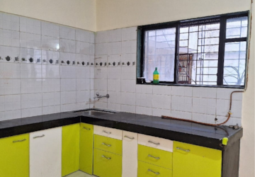 Kitchen in 2 BHK Apartment at Swatnapurti Housing Society, Kharadi Bypass Road – for Rent