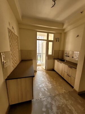 Kitchen in 3 BHK Apartment at Amrapali Platinum, Sector 119 – for Sale