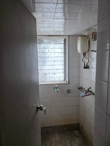 Bathroom in 2 BHK Apartment at Nandavan CHS, Vile Parle East – for Rent