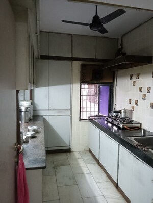 Kitchen in 2 BHK Apartment at Adarsh CHS Vasant Vihar, Vasant Vihar – for Sale