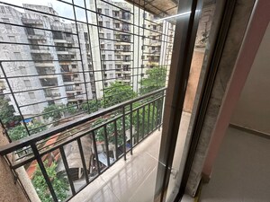 Balcony in 1 BHK Apartment at Unnathi Woods Phase 1 And 2, Ghodbunder Road – for Rent