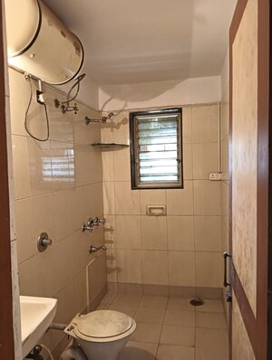 Bathroom in 4 BHK Apartment at Windsor Garden Enclave, Vasant Vihar – for Sale