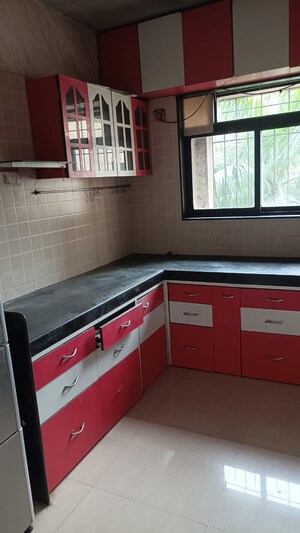 Kitchen in 2 BHK Apartment at Swastik Regalia, Waghbil – for Rent