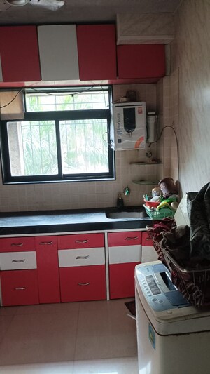 Kitchen in 2 BHK Apartment at Swastik Regalia, Waghbil – for Rent