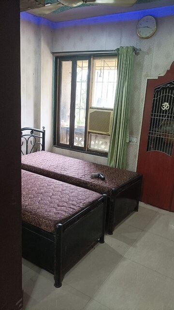 Bedroom in 2 BHK Apartment at Swastik Regalia, Waghbil – for Rent
