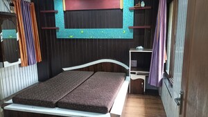 Bedroom in 2 BHK Apartment at Swastik Regalia, Waghbil – for Rent