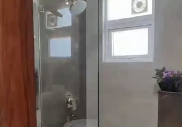 Bathroom in 1 BHK Apartment at Crossing Republik, Crossing Republic – for Rent