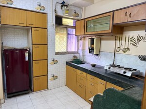 Kitchen in 1 BHK Apartment at Swastik Park CHS, Brahmand – for Sale