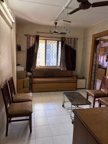 Living Room in 1 BHK Apartment at Swastik Park CHS, Brahmand – for Sale