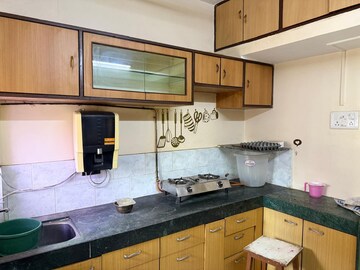 Kitchen in 1 BHK Apartment at Swastik Park CHS, Brahmand – for Sale