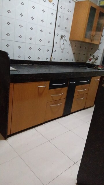 Kitchen in 2 BHK Apartment at Riddhi Garden, Malad East – for Rent