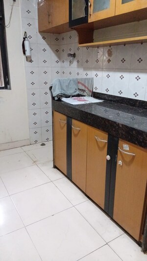 Kitchen in 2 BHK Apartment at Riddhi Garden, Malad East – for Rent