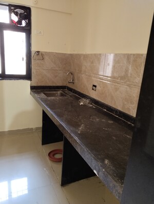 Kitchen in 1 BHK Apartment at Dosti Planet North Tower Elmore, Shilphata – for Sale