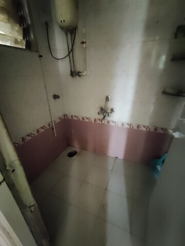 Bathroom in 1 BHK Apartment at Parijat Gardens Marigold CHS, Kasarvadavali – for Rent