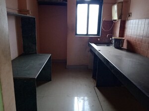 Kitchen in 2 BHK Apartment at Kavya Hill View CHS, Anand Nagar – for Rent