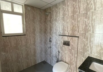 Bathroom in 2 BHK Apartment at Shapoorji Pallonji Joyville Phase 2, Sector 102 – for Rent