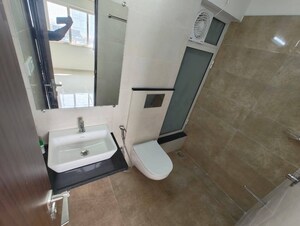 Bathroom in 2 BHK Apartment at Omkar Signet, Malad East – for Rent