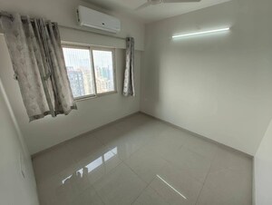 Room in 2 BHK Apartment at Omkar Signet, Malad East – for Rent
