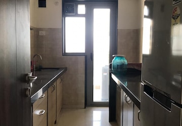 Kitchen in 3 BHK Apartment at Adani Western Heights Sky Apartments, Bhudargarh Colony – for Sale