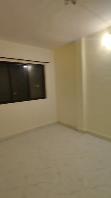 Living Room in 1 BHK Apartment at Queens Park, Mira Road – for Sale
