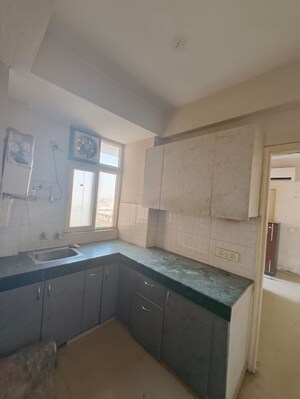 Kitchen in 2 BHK Apartment at Shree Vardhman Green Court, Sector 90 – for Rent