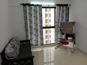Living Room in 2 BHK Apartment at Lodha Palava Downtown Dombivli East, Dombivli East – for Rent