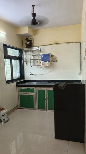 Kitchen in 2 BHK Apartment at Rupali CHS, Malad West – for Rent