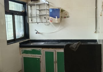 Kitchen in 2 BHK Apartment at Rupali CHS, Malad West – for Rent