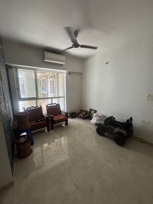Living Room in 1 BHK Apartment at Lodha Amara, Kolshet Road – for Sale