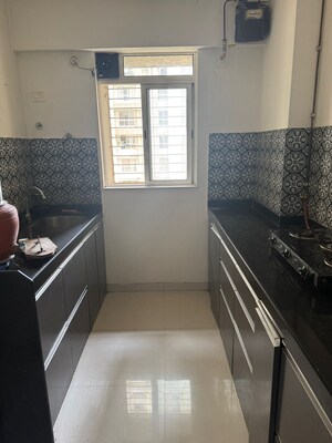 Kitchen in 1 BHK Apartment at Lodha Amara, Kolshet Road – for Sale