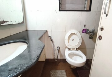 Bathroom in 1 BHK Apartment at Siddhanchal CHS, Pawar Nagar – for Rent