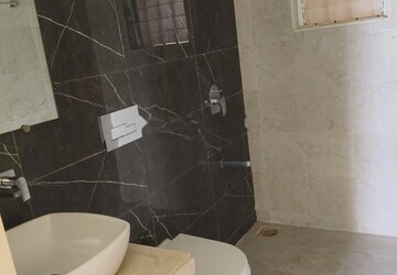 Bathroom in 1.5 BHK Apartment at Dosti West County, Balkum Pada – for Rent