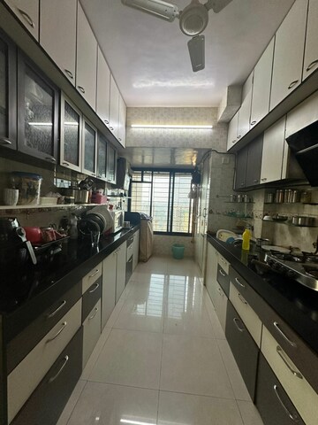 Kitchen in 2 BHK Apartment at Maharaja Retreat CHS, Goregaon East – for Rent