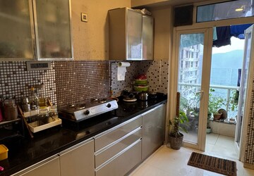 Kitchen in 2 BHK Apartment at Omkar Alta Monte, Malad East – for Rent