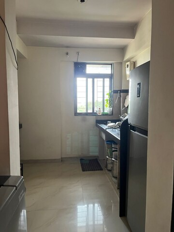 Kitchen in 1 BHK Apartment at Damji Shamji Shah Mahavir Estella, Ghodbunder Road – for Sale