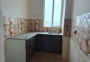 Kitchen in 2 BHK Apartment at Amrapali Dream Valley, Tech Zone 4 Greater Noida – for Rent