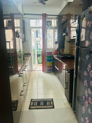 Kitchen in 2.5 BHK Apartment at Amrapali Zodiac, Sector 120 – for Sale