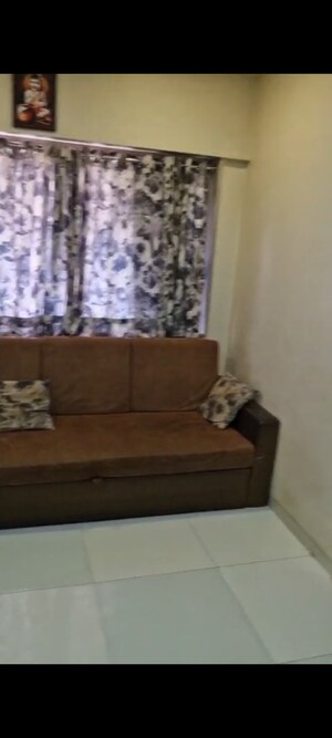 Living Room in 1 BHK Apartment at Borivali East – for Sale