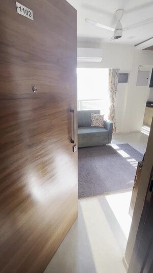 Living Room in 1 BHK Apartment at Romell Amore, Andheri West – for Sale